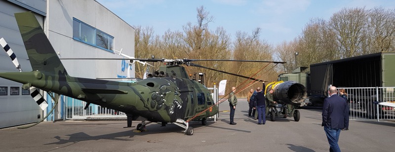 Belgian military Agusta H22 helicopter and a F16 jetmotor